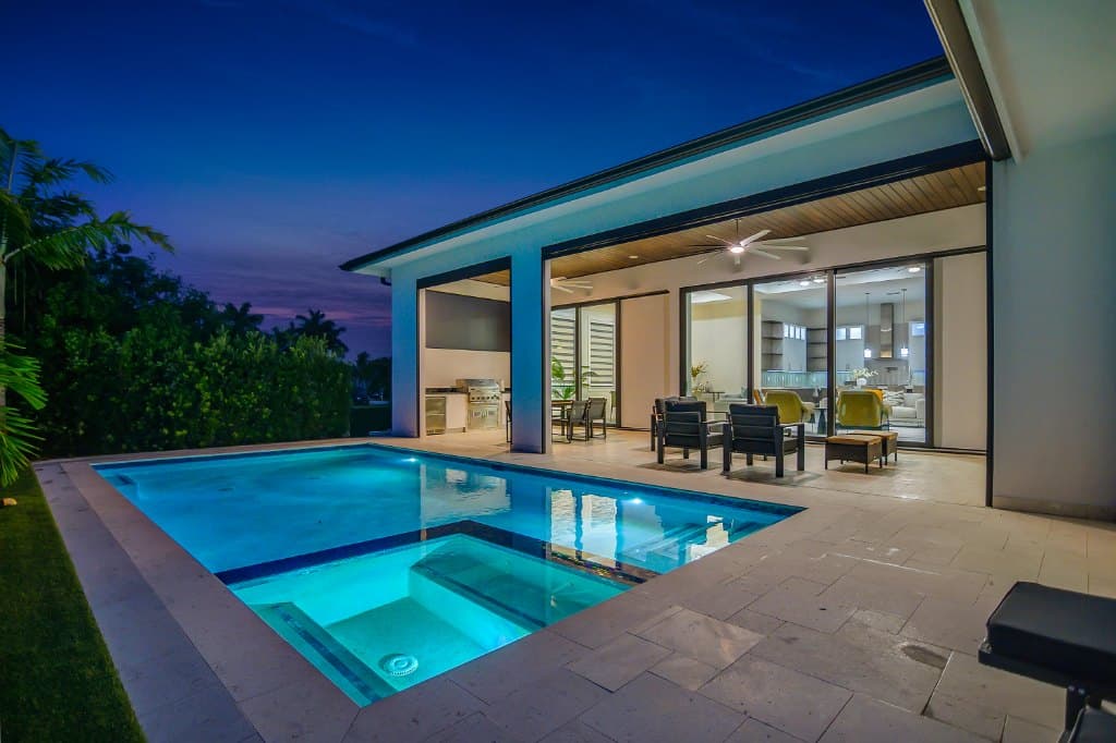 View of pool with outdoor lounge and dining